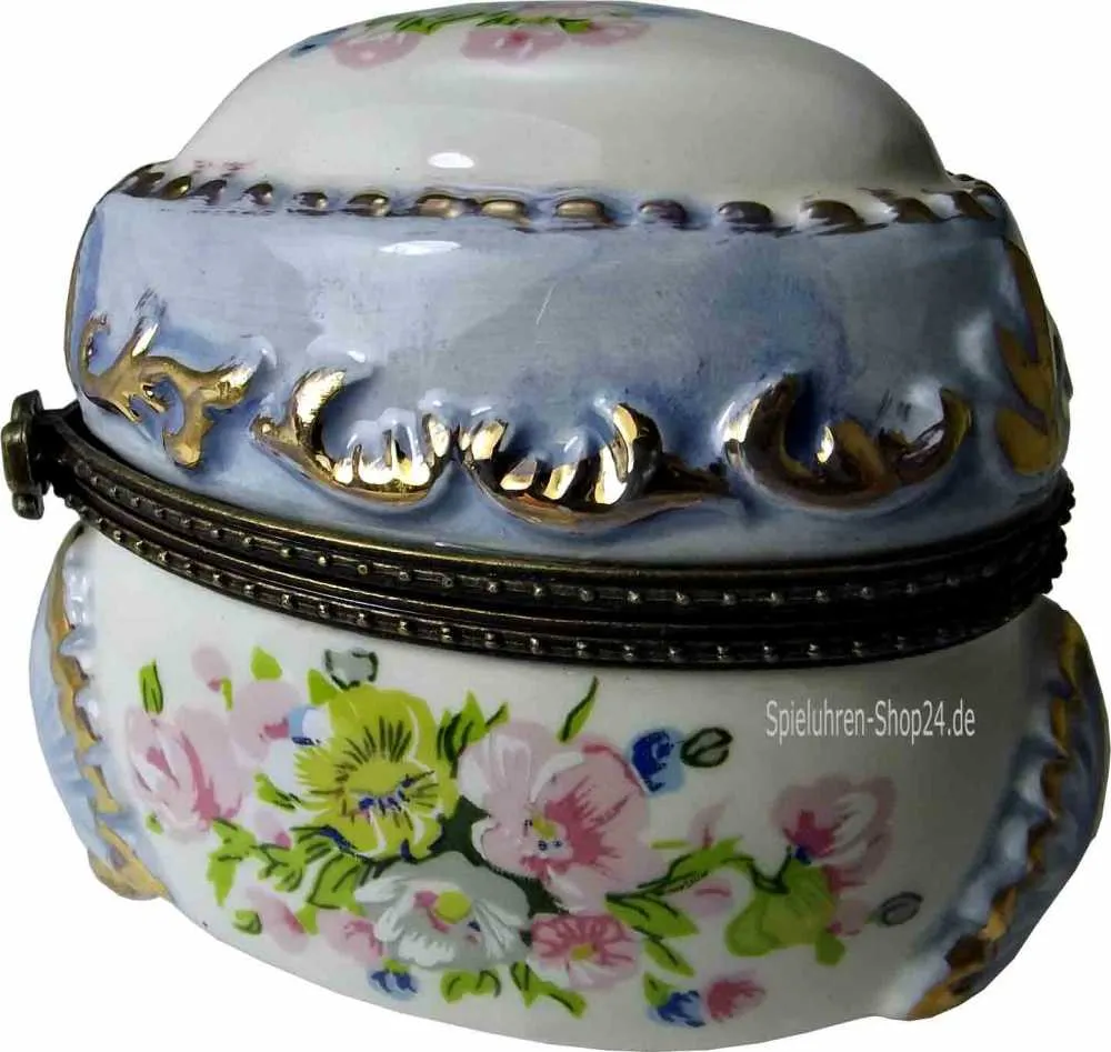 Pillendose Porzellan Frühlingsblumen mit Miniatur-Spieluhr, von der Seite